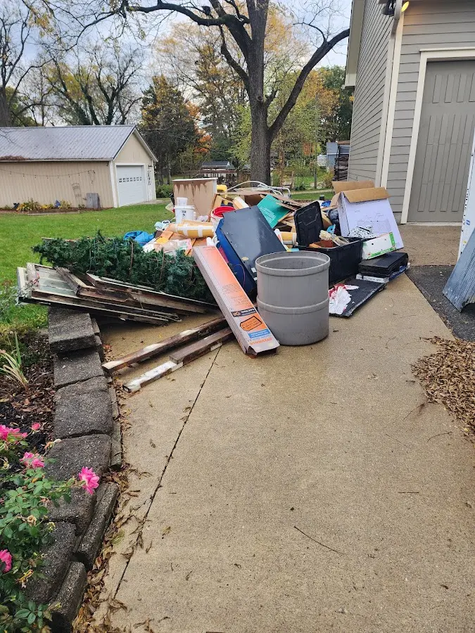 Dumpster being loaded with debris for Estate Cleanout Dumpster Rental in Lewisboro